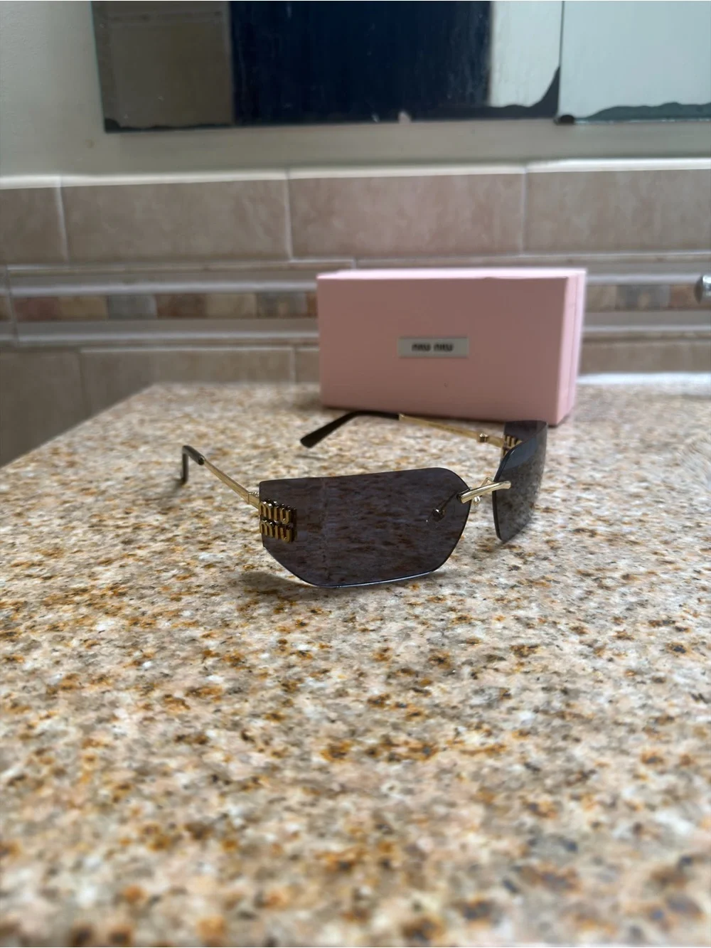 Miu Miu Rimless Sunglasses with Black Lenses and Gold Temples